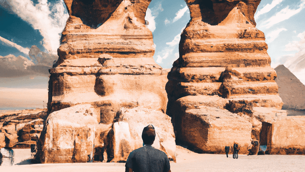 Tourist walking towards ancient Sphinx statues, Giza, Egypt.